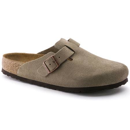 The Birkenstock Boston SF in taupe suede for adults is a stylish slip-on clog that features a cork footbed, an adjustable strap, and the option of a Soft Footbed for enhanced comfort.