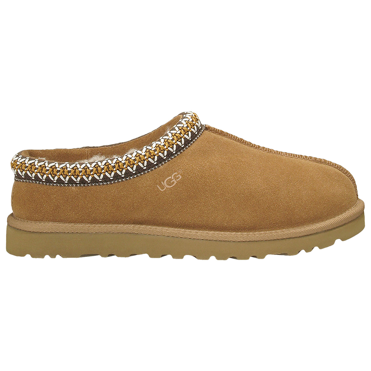 A side view of a single tan UGG TASMAN CHESTNUT - WOMENS slip-on shoe with a sheepskin lining and patterned trim around the opening, featuring a durable Treadlite outsole and the brand name &quot;Ugg&quot; imprinted on the side.