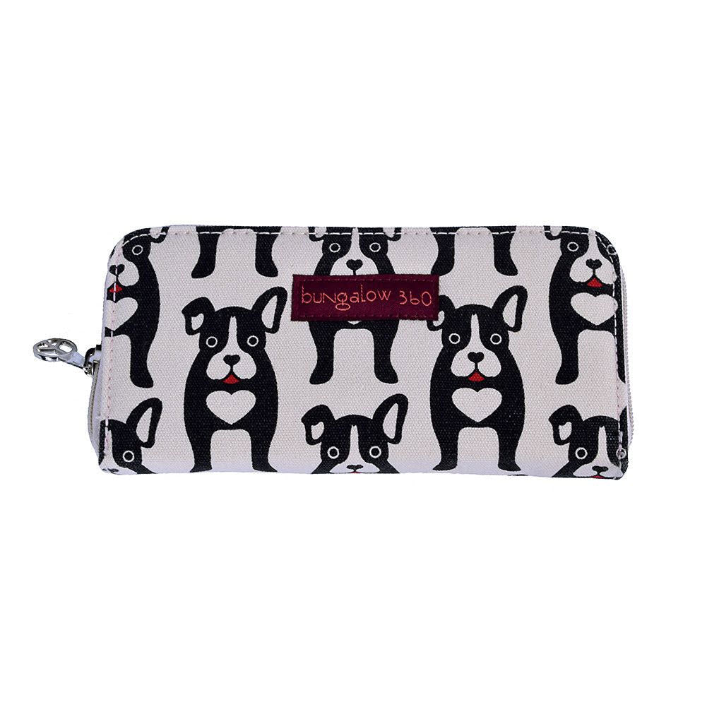 The BUNGALOW 360 ZIP AROUND WALLET BLACK DOGS by Bungalow 360 is a 100% vegan wallet made from durable natural cotton canvas, featuring a black and white dog pattern and a small red label that reads &quot;bungalow 360.