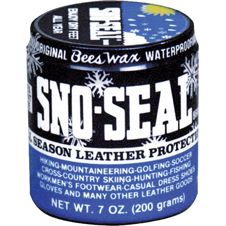 A 7 oz (200 grams) container of SNO SEAL 7 OZ, a beeswax-based product designed for superior leather protection by Snow Seal. The label highlights its waterproofing uses for activities like hiking, skiing, golfing, and more.