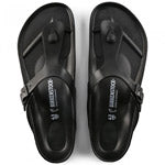 A pair of BIRKENSTOCK GIZEH EVA BLACK - WOMENS with the brand name printed in white on the straps, featuring waterproof EVA foam and excellent arch support.