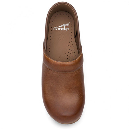 Top view of a single Dansko Professional Honey Distressed - Women&#39;s clog with the Dansko logo on the insole, providing all-day support.