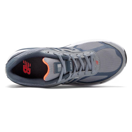 Top view of a gray and blue New Balance NEW BALANCE 1540V3 GUNMETAL/DRAGONFLY - WOMENS running shoe with a black insole and red logo detailing, designed for overpronation.