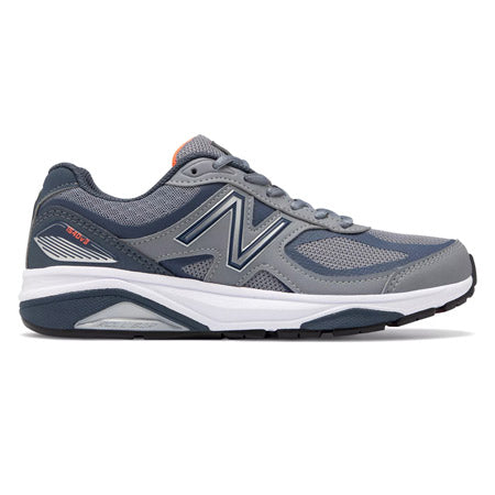 A side view of a gray and navy women&#39;s running shoe with a white sole, featuring ENCAP midsole technology for added support and the New Balance logo on the side. The product is called &quot;NEW BALANCE 1540V3 GUNMETAL/DRAGONFLY - WOMENS&quot; by New Balance.