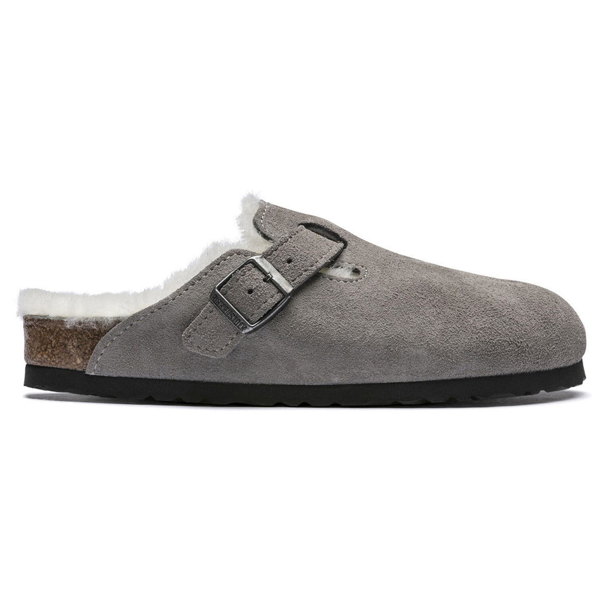 Birkenstock BIRKENSTOCK BOSTON SHEARLING STONE COIN - WOMENS with a black sole and faux fur lining, featuring an adjustable metal buckle strap across the top and an anatomically formed cork-latex footbed.