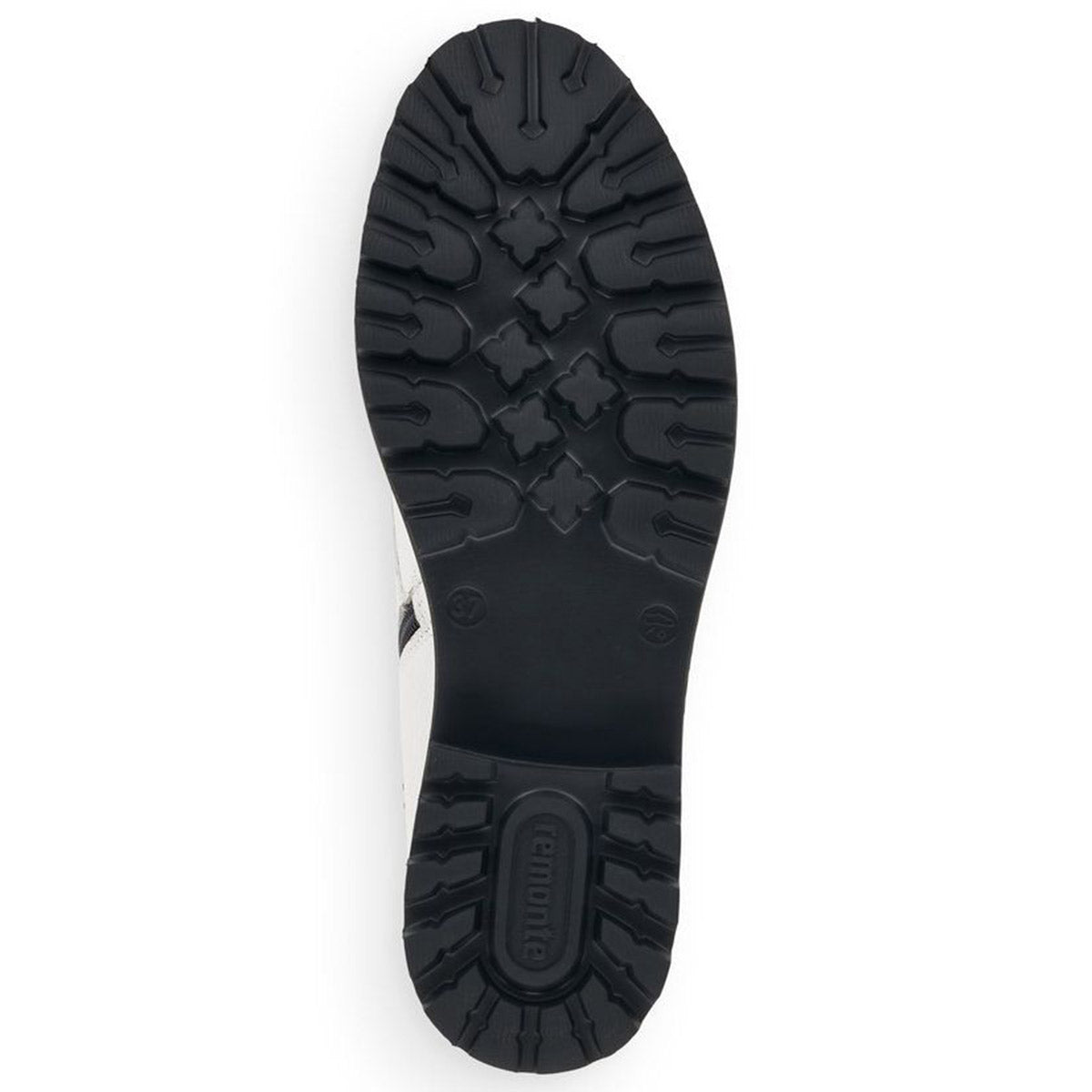 The image displays the tread of a black rubber sole from the REMONTE D8671 BOOT WHITE - WOMENS, highlighting various geometric patterns along with the brand name &quot;Remonte&quot; in the center. The boot itself, featuring a synthetic upper, is white with visible stitching.