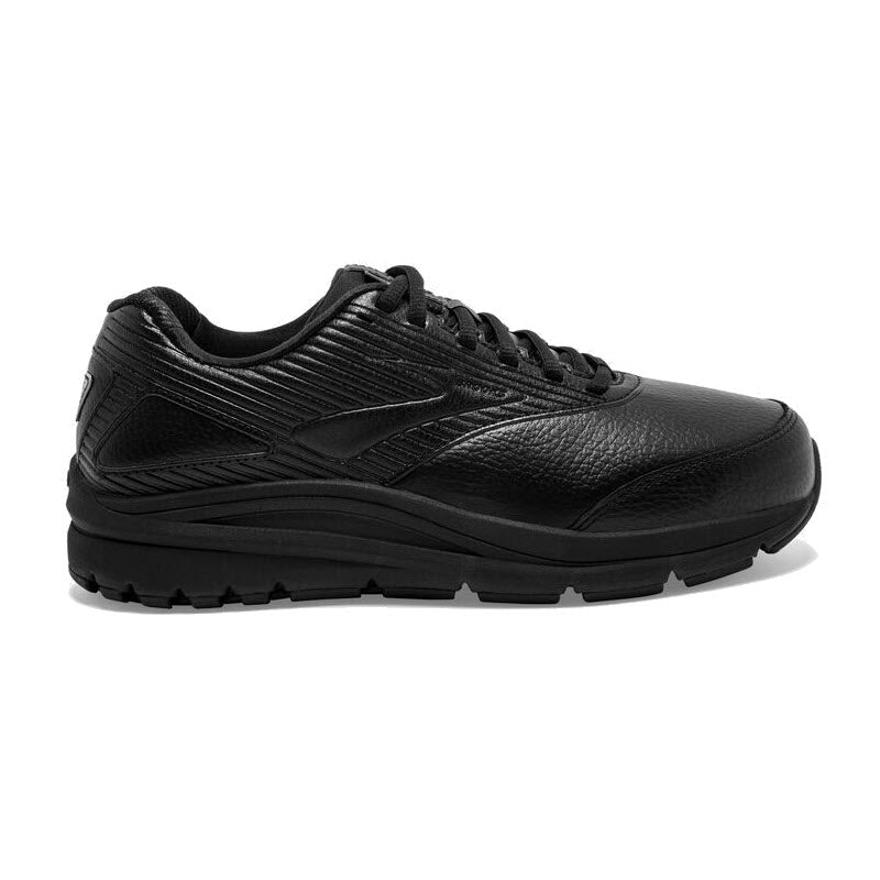 A side view of the Brooks Addiction Walker 2 Lace Black women&#39;s athletic shoe reveals its sleek design, featuring textured leather and synthetic materials, laces, and a thick sole engineered for comfort and stability. The shoe is equipped with the BioMoGo DNA midsole to ensure every step is supported and cushioned.