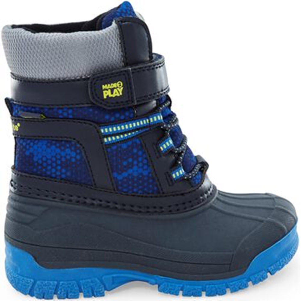 The STRIDE RITE M2P FROST TREK NAVY MULTI - KIDS by Stride Rite is a children's winter boot with a gray and blue color scheme. It features a thick sole, Velcro strap, and laces. These cold weather boots are designed for playing in the snow or chilly conditions, ensuring warmth and comfort.