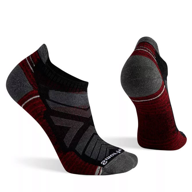 Pair of SMARTWOOL HIKE LIGHT LOW MENS CHARCOAL with gray accents shown from side and heel views, featuring Indestructawool technology reinforced toe and heel for added durability by Smartwool.