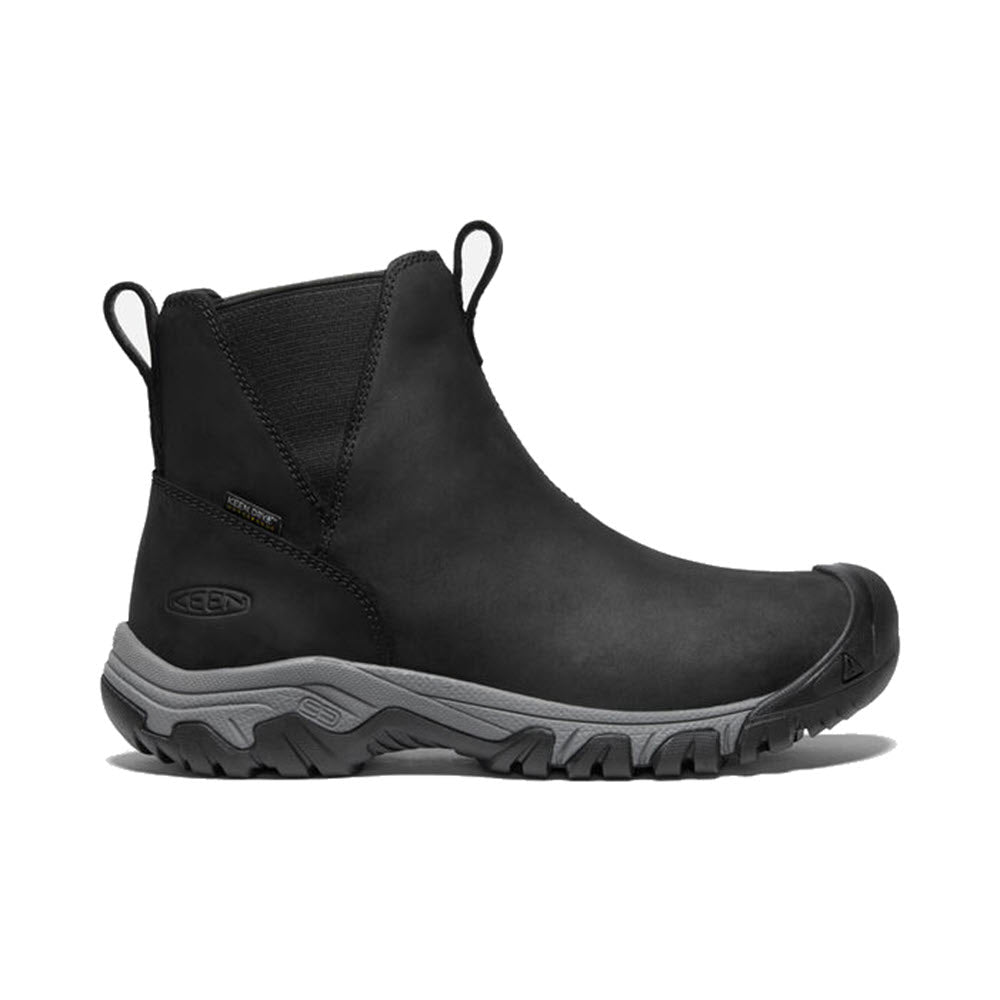 Side view of the KEEN GRETA BLACK/STEEL GREY women’s waterproof winter boot with elastic side panels, pull tabs, and a grey outsole bearing the Keen logo. Equipped with KEEN.WARM insulation and a Thermal Heat Shield insole for added comfort and warmth.