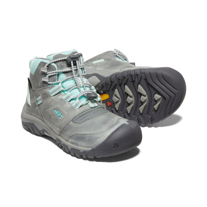 A pair of Keen KEEN RIDGE FLEX MID CHILD GREY/BLUE TINT - KIDS with rugged soles, lace-up closures, padded collar, and ankle support.