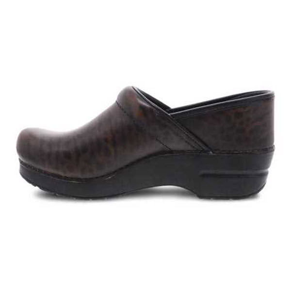 Side view of a DANSKO PROFESSIONAL ZEBRA BRUSH OFF - WOMENS by Dansko with a black sole, featuring an anti-fatigue rocker bottom, slight heel, and closed toe design.