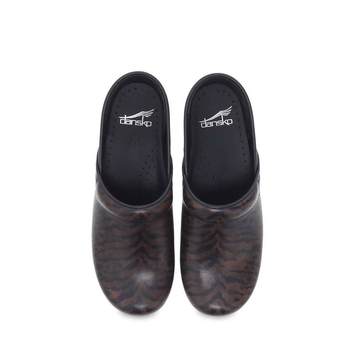 A pair of black and brown patterned Dansko Professional clogs with closed toes, insoles featuring the Dansko logo, and an anti-fatigue rocker bottom for superior comfort.

Revised: A pair of black and brown patterned DANSKO PROFESSIONAL ZEBRA BRUSH OFF - WOMENS from Dansko with closed toes, insoles featuring the Dansko logo, and an anti-fatigue rocker bottom for superior comfort.