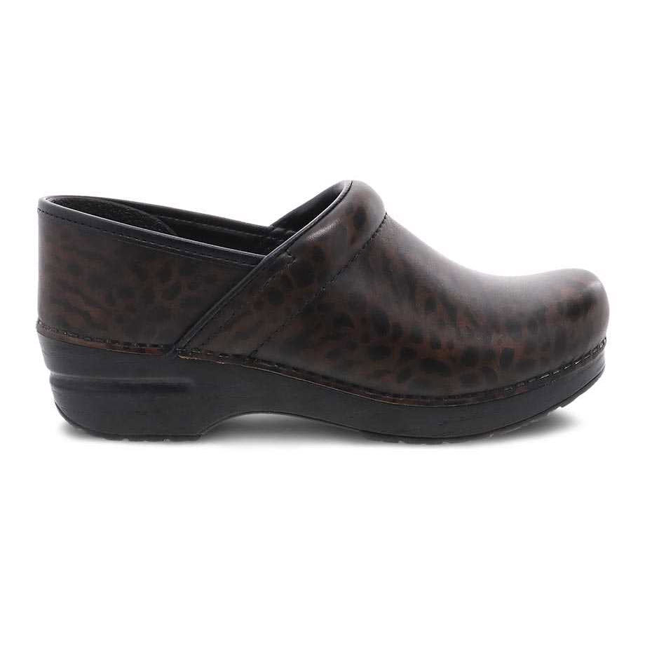 Dark-colored DANSKO PROFESSIONAL ZEBRA BRUSH OFF - WOMENS with a slight heel, featuring a leopard pattern, closed rounded toe, and an anti-fatigue rocker bottom for ultimate comfort by Dansko.