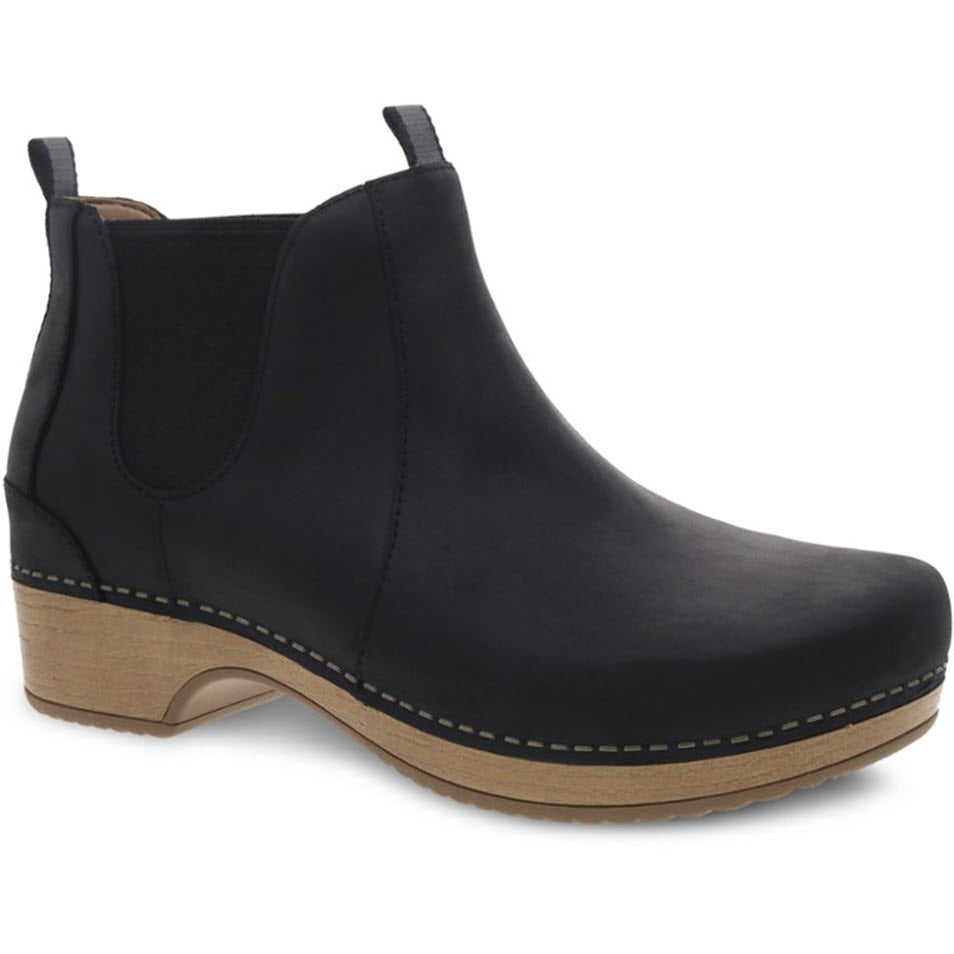 A black leather ankle boot with a wooden sole and slight heel, featuring elastic side panels and a pull tab on the back, much like the stylish Dansko Becka Black - Women boots from Dansko.