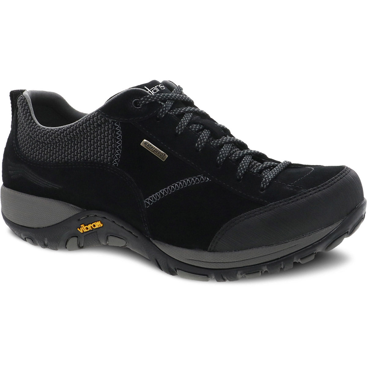 A black and grey lace-up walking shoe with rugged sole and mesh accents, crafted from waterproof leather. The heel features Vibram branding, presenting the Dansko DANSKO PAISLEY BLACK/BLACK SUEDE - WOMEN.