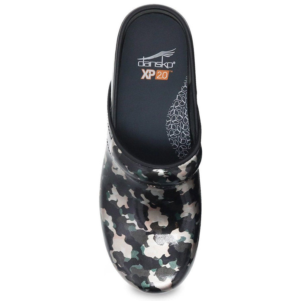 A top view of a single Dansko DANSKO PRO XP 2.0 CAMO PATENT - WOMENS clog featuring a black, gray, and white camouflage pattern design, complete with a slip-resistant outsole and ergonomic footbed for ultimate comfort.