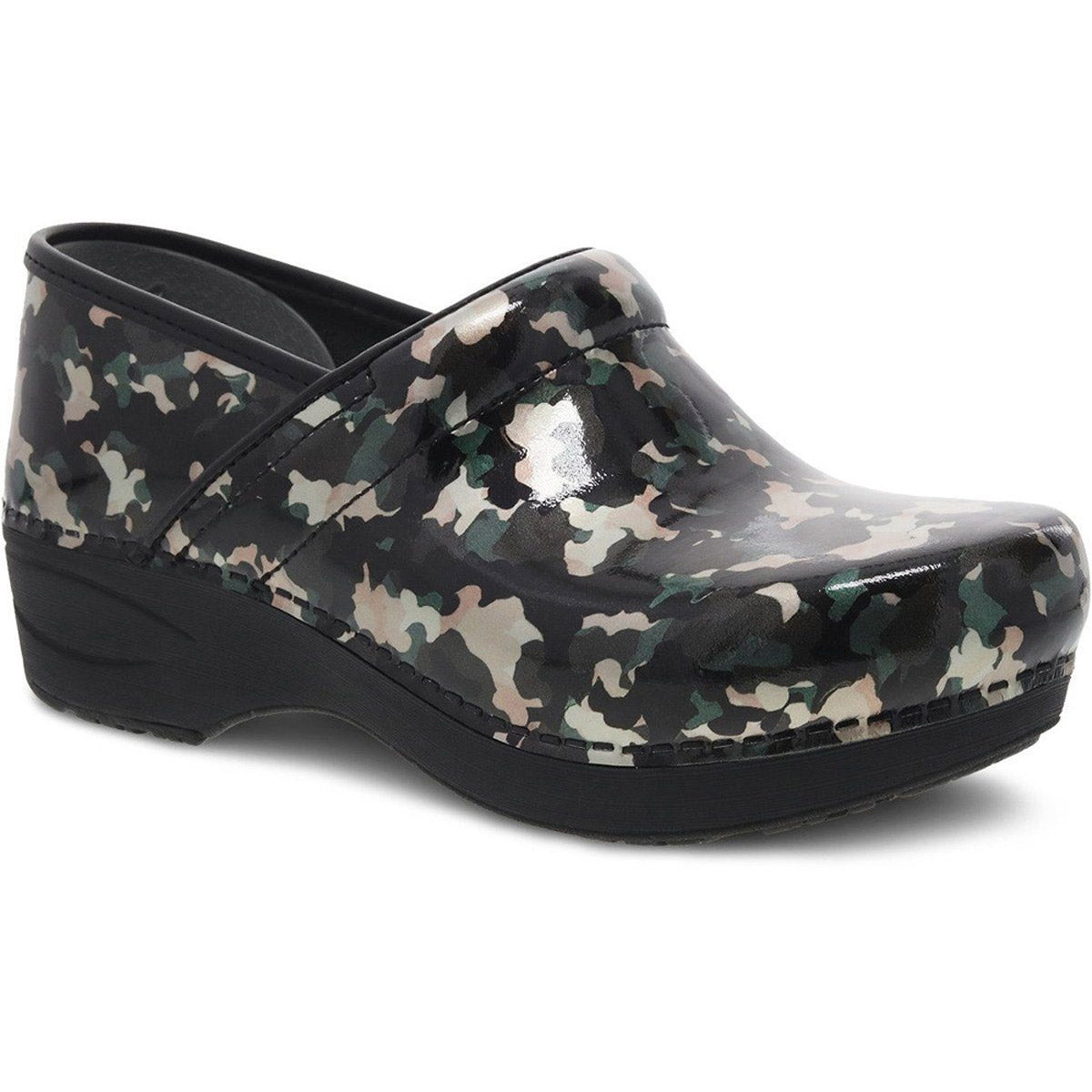 A single patterned clog shoe with a black and white camouflage design, featuring a thick sole, closed heel and toe, and an ergonomic footbed. Enjoy the added security of a slip-resistant outsole with the stylish DANSKO PRO XP 2.0 CAMO PATENT - WOMENS by Dansko.
