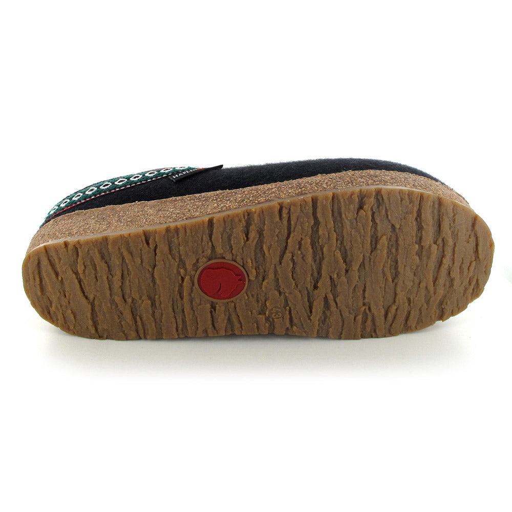 Bottom view of the Haflingers HAFLINGER GZ BLACK - ADULTS shoe showing a beige, textured sole with a red rubber circular detail near the heel.