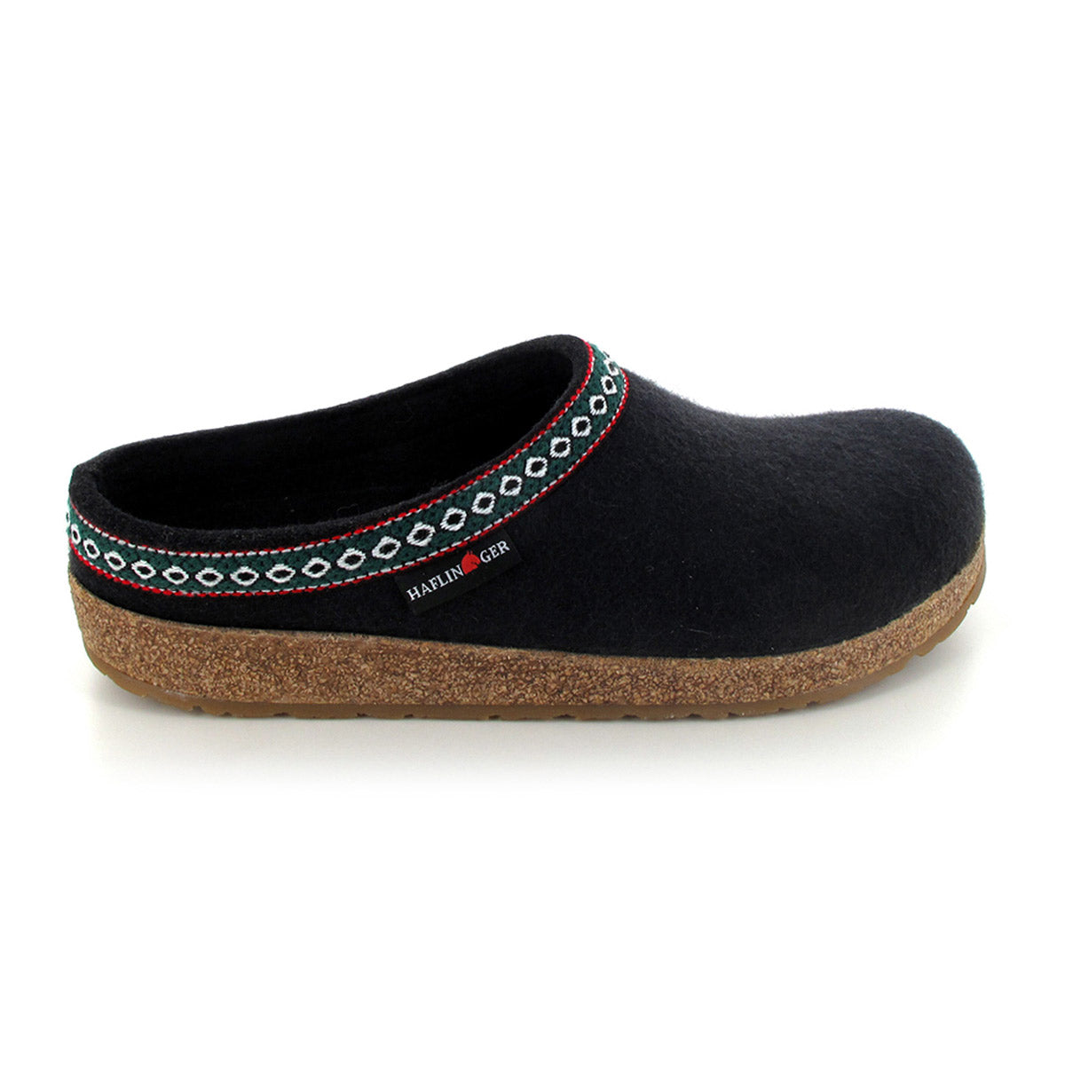 A black wool felt slipper with an anatomical cork footbed, featuring a patterned trim around the opening and a small tag with text on the side. This Haflingers HAFLINGER GZ BLACK - ADULTS design ensures both comfort and style.