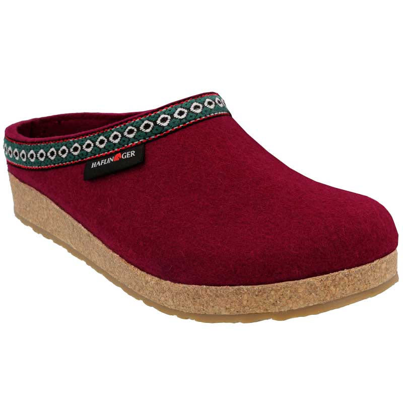 A HAFLINGER GZ CHILI - WOMENS with a cork and latex midsole and a decorative band around the opening, featuring the &quot;Haflingers&quot; brand tag.