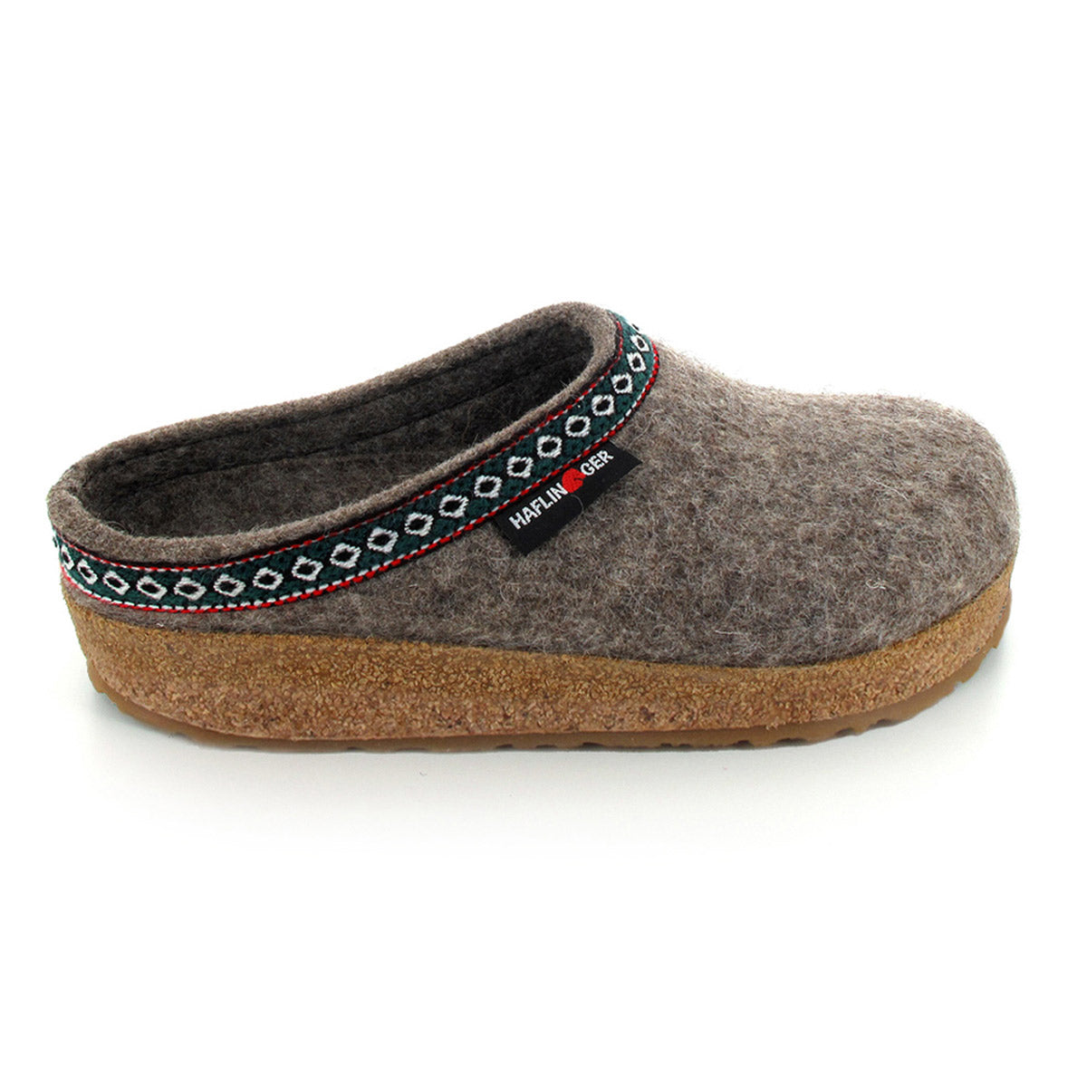 A single brown felt slipper with a patterned trim around the opening, featuring an anatomical cork footbed and a small tag with the brand name &quot;Haflingers HAFLINGER GZ EARTH - WOMENS&quot;. The slipper offers comfort and practicality for everyone.