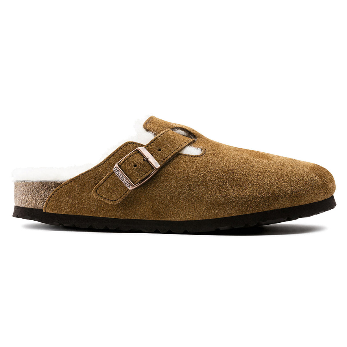 A brown suede Birkenstock BOSTON SHEARLING MINK - WOMENS with a buckle strap, shearling lining, and a cork-latex footbed, featuring a black sole.