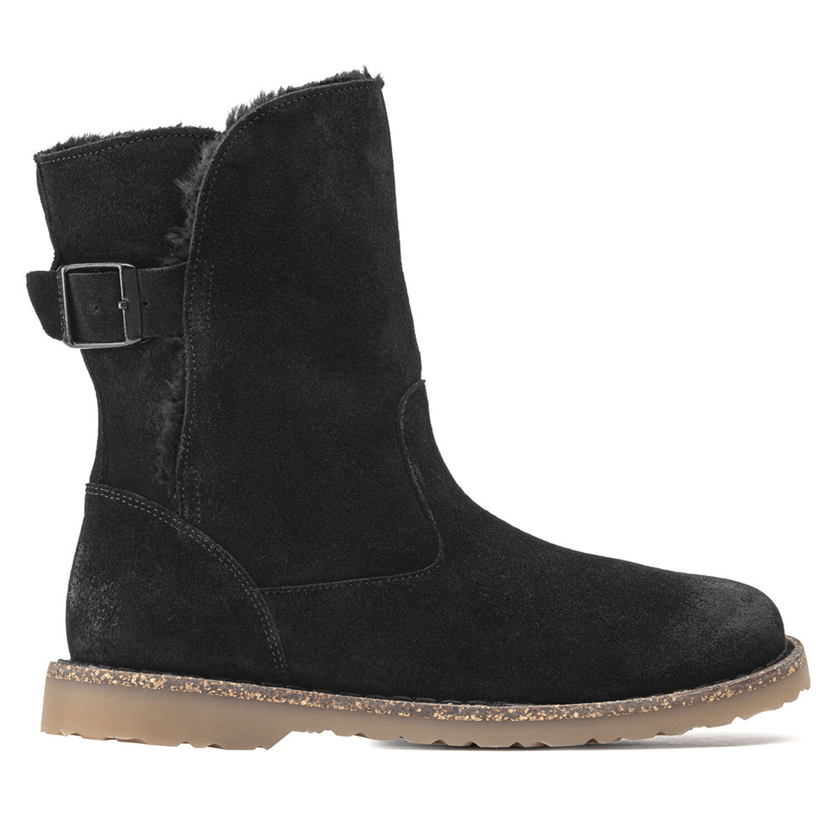 The BIRKENSTOCK UPSALLA SHEARLING BLACK SUEDE - WOMENS by Birkenstock is a black suede boot with a side buckle, shearling lining, and a flat sole with a speckled pattern.