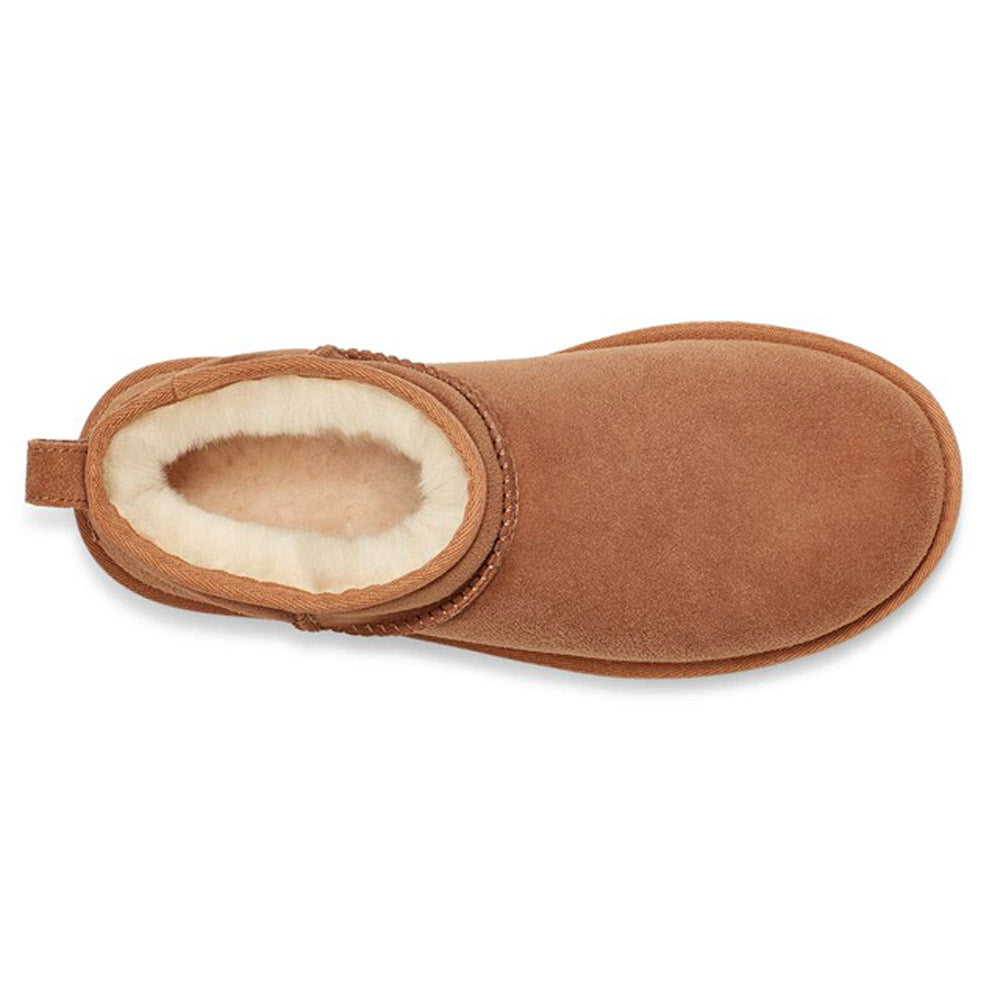 A single brown suede slipper boot lined with white wool, viewed from the top. The Ugg UGG CLASSIC ULTRA MINI CHESTNUT - WOMENS features Twinface sheepskin for ultimate comfort.