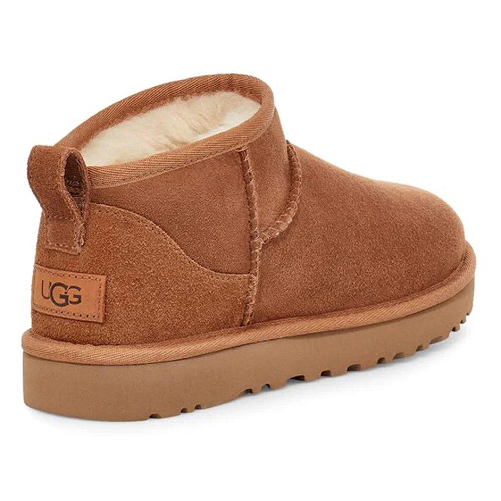 The UGG CLASSIC ULTRA MINI CHESTNUT - WOMENS by Ugg features a short, ankle-high design with Twinface sheepskin lining and a sturdy Treadlite by UGG sole.