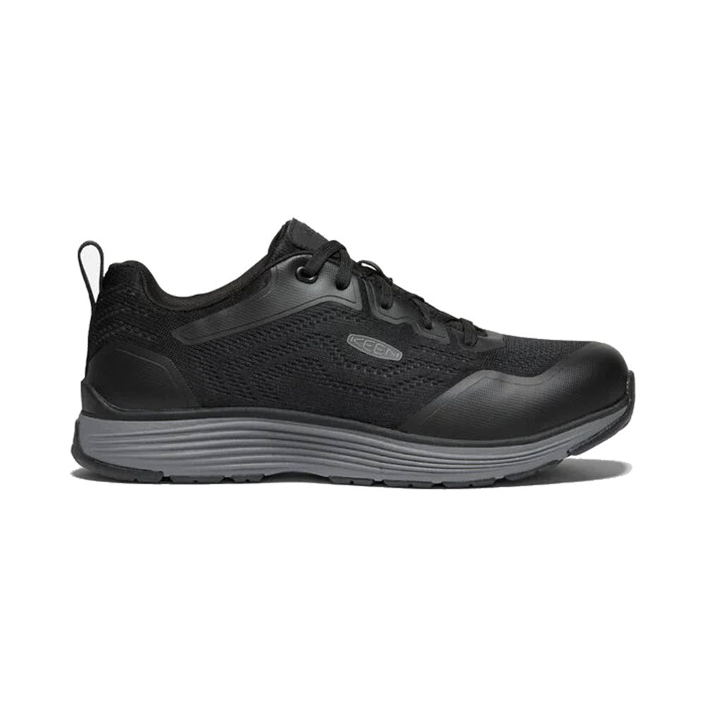 The KEEN Sparta II Safety Toe EH Black/Gray for men is a stylish black athletic shoe featuring an aluminum safety toe, a gray sole, and black laces. It boasts a mesh upper with the Keen logo on the side and meets non-slip testing standards to ensure superior traction.