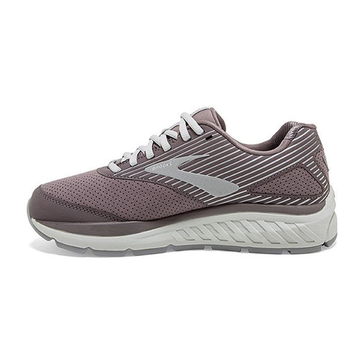 The BROOKS ADDICTION WALKER SUEDE SHARK/ALLOY - WOMENS by Brooks is a single gray and white athletic shoe with a textured upper, lace-up closure, and cushioned sole featuring a BioMoGo DNA midsole, viewed from the side.