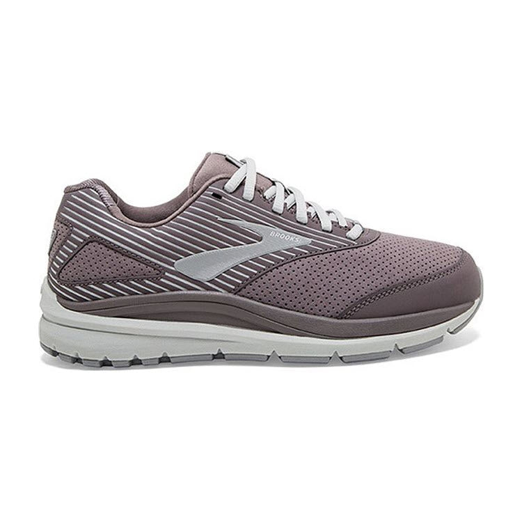 Side view of the Brooks Addiction Walker Suede Shark/Alloy women&#39;s walking shoe, showcasing a grey athletic design with a white sole, light grey laces, and striped detailing on the heel and sides. This shoe features a cushioned insole for enhanced comfort.