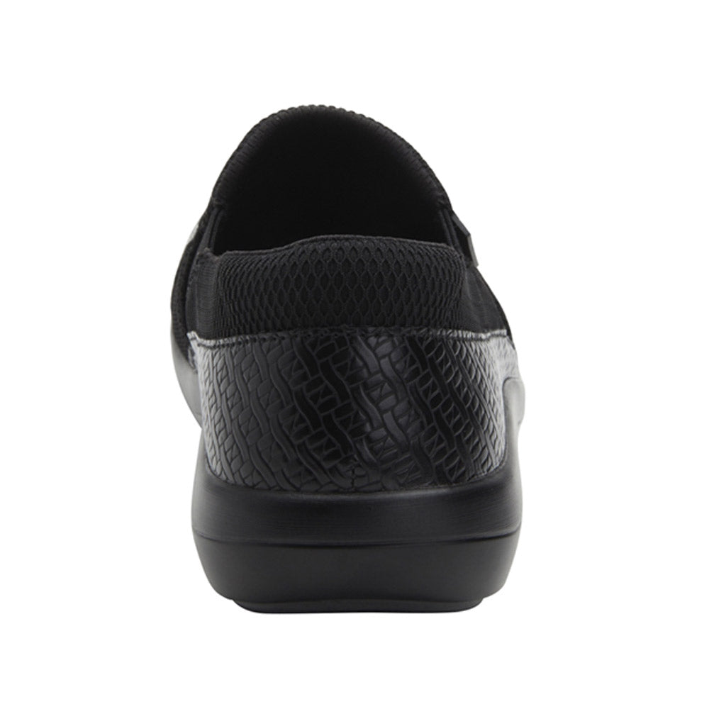 Rear view of ALEGRIA DUETTE BLACK WOVEN - WOMENS by Alegria, featuring textured details on the heel and sides, with a slip-resistant outsole for added safety.