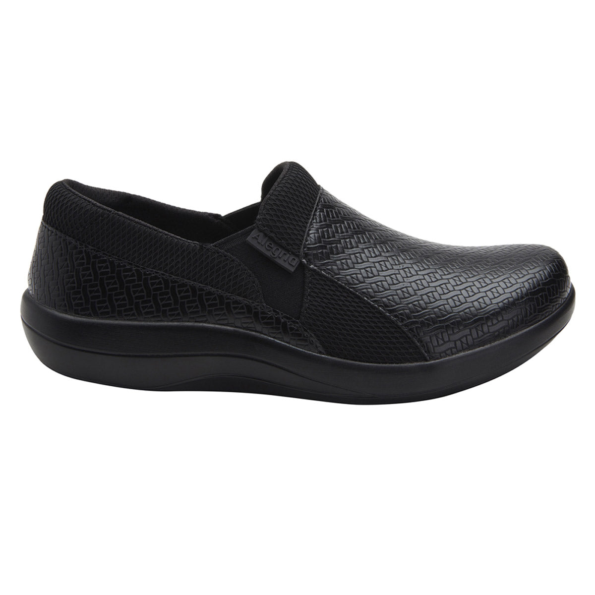 A black nursing shoe featuring a textured, woven upper and a smooth, cushioned sole with enhanced shock absorption and a slip-resistant outsole is the ALEGRIA DUETTE BLACK WOVEN - WOMENS by Alegria.