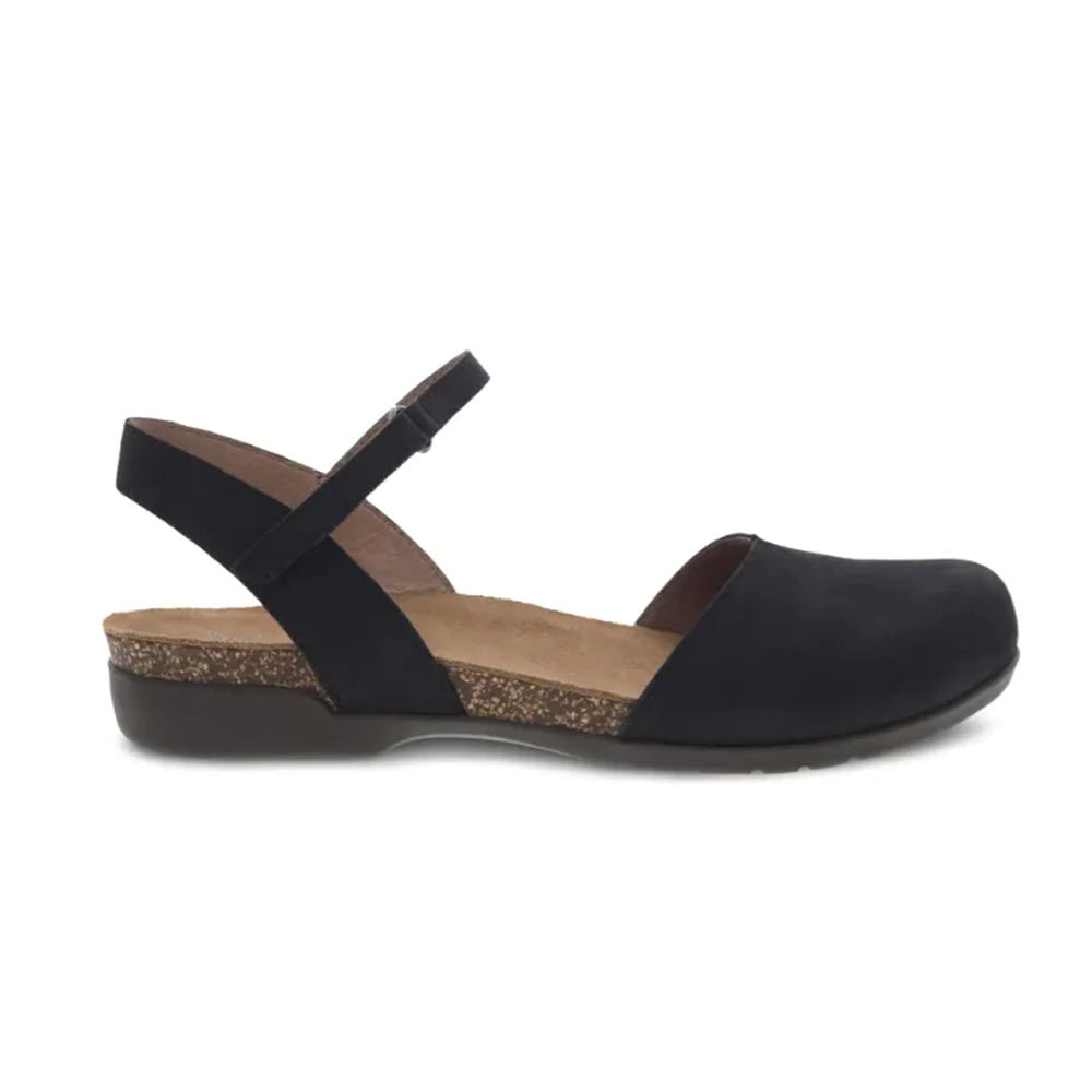 The Dansko DANSKO ROWAN BLACK NUBUCK - WOMENS is a black closed-toe summer sandal with a cork sole and adjustable ankle strap, featuring a low heel and memory foam footbeds for added comfort.