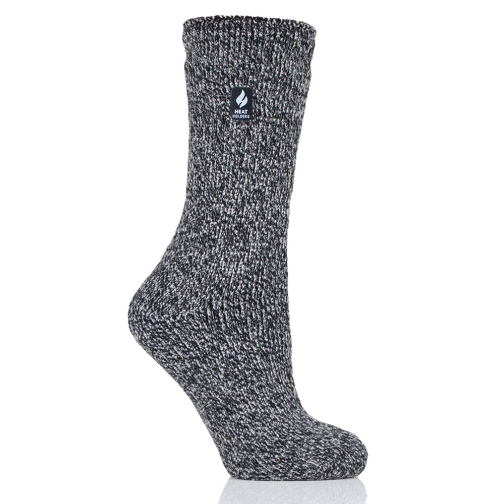 Gray speckled thermal sock displayed against a white background, standing upright with a black logo on the cuff, perfect for keeping your feet warm: HEATHOLDERS VIOLA LITE TWIST BLACK - WOMENS by Heatholders.