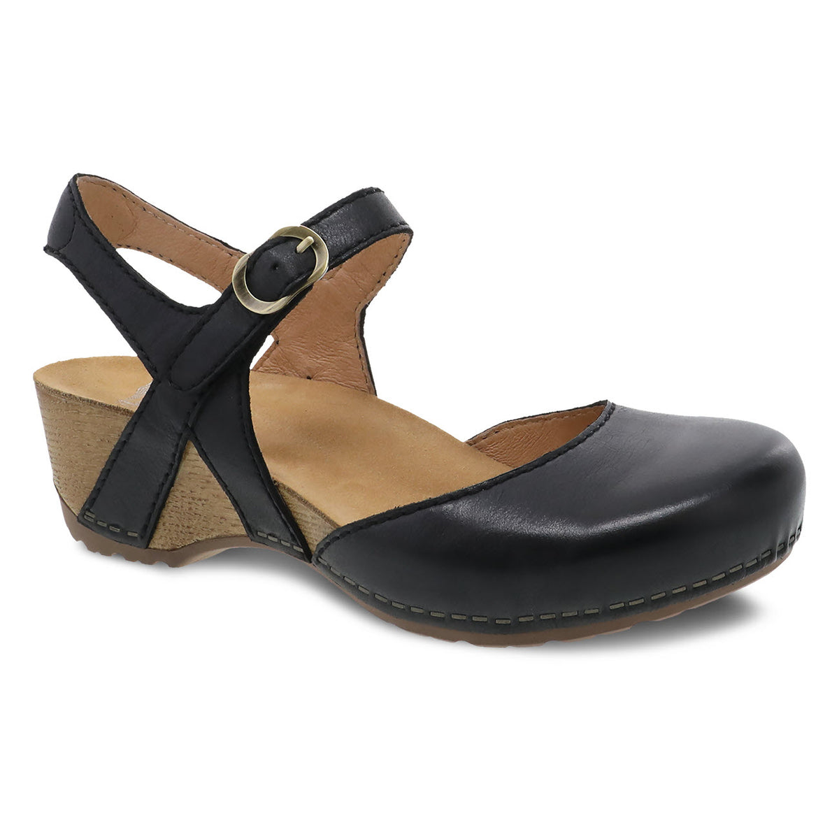 The Dansko DANSKO TIFFANI BLACK - WOMENS features burnished leather uppers in a sophisticated black women&#39;s sandal with a low wedge heel, closed toe, and an adjustable strap with a buckle on the side. The contoured footbed ensures comfort and support for all-day wear.