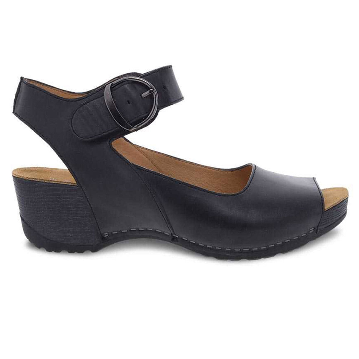 The Dansko Tiana Black Burnished women&#39;s shoe is a stylish yet comfy sandal, featuring an open-toe design with an ankle strap and buckle, along with a low wedge heel and detailed stitching.