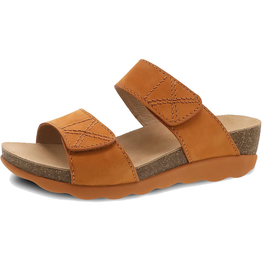 The DANSKO MADDY ORANGE MILLED NUBUCK - WOMENS sandal by Dansko, featuring two adjustable straps and a lightweight cork midsole, is displayed against a white background.