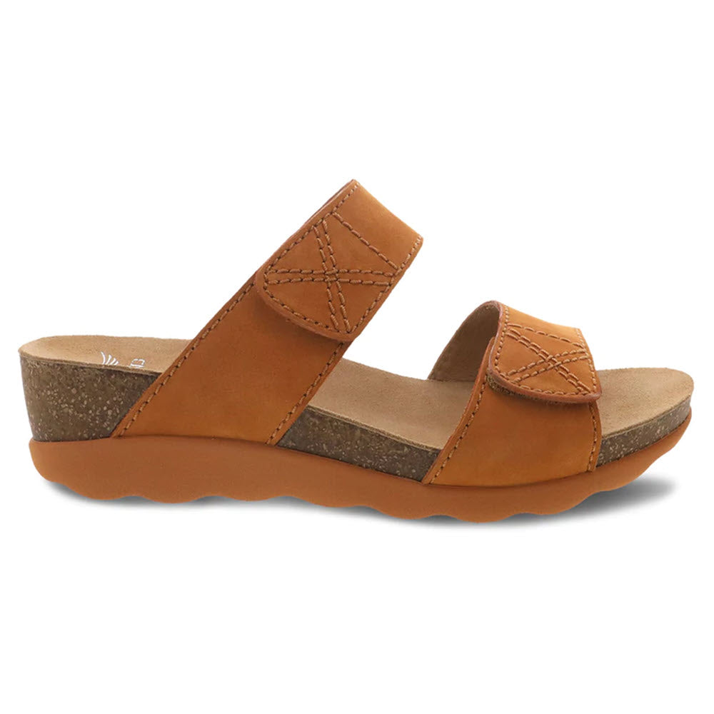 The DANSKO MADDY ORANGE MILLED NUBUCK - WOMENS sandal by Dansko features an open-toe design, two adjustable straps, a lightweight cork midsole, and a wavy rubber outsole.