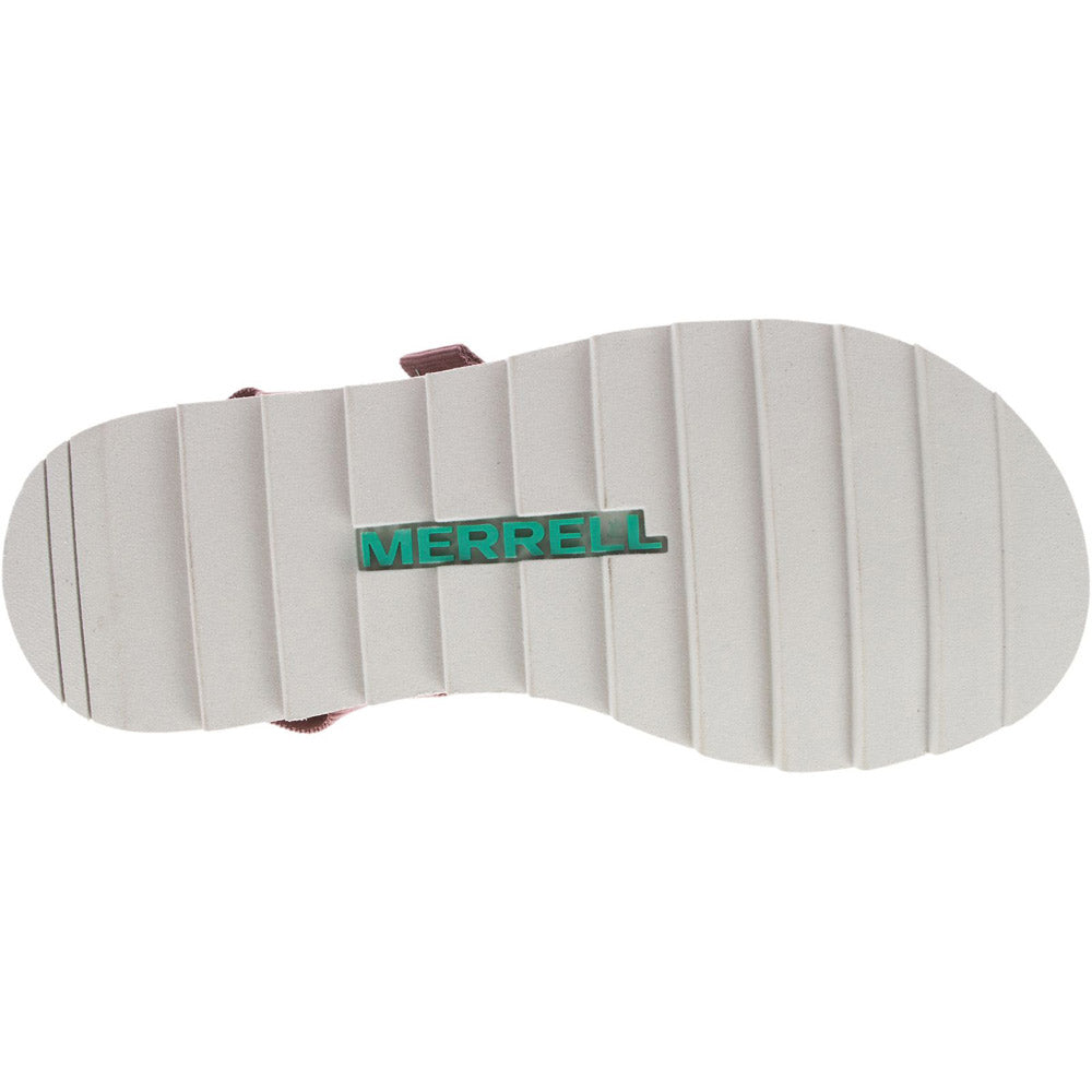 Bottom view of the MERRELL ALPINE STRAP BURLWOOD - WOMENS sandal showing a white grooved sole with the brand name &quot;Merrell&quot; imprinted in green letters, featuring an EVA foam insole for added comfort.