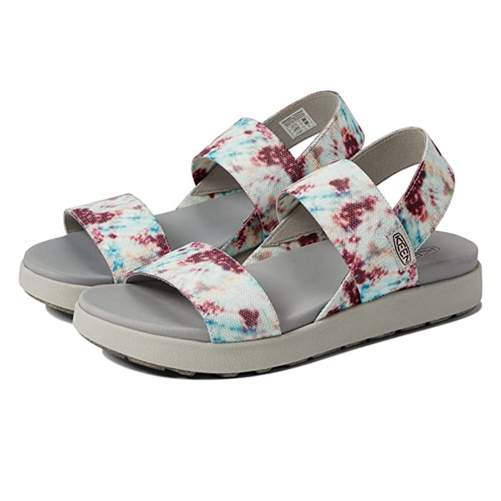 The KEEN ELLE BACKSTRAP ANDORRA TIE DYE - WOMENS by Keen showcases an eco-friendly design with multicolored straps and a cushioned footbed for a blend of style and comfort.