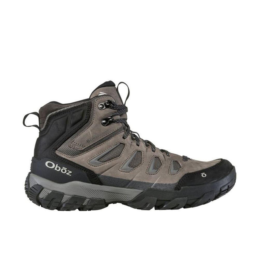 A brown and black high-top hiking boot with a rugged sole, reliable traction, and the brand name &quot;Oboz&quot; on the side.