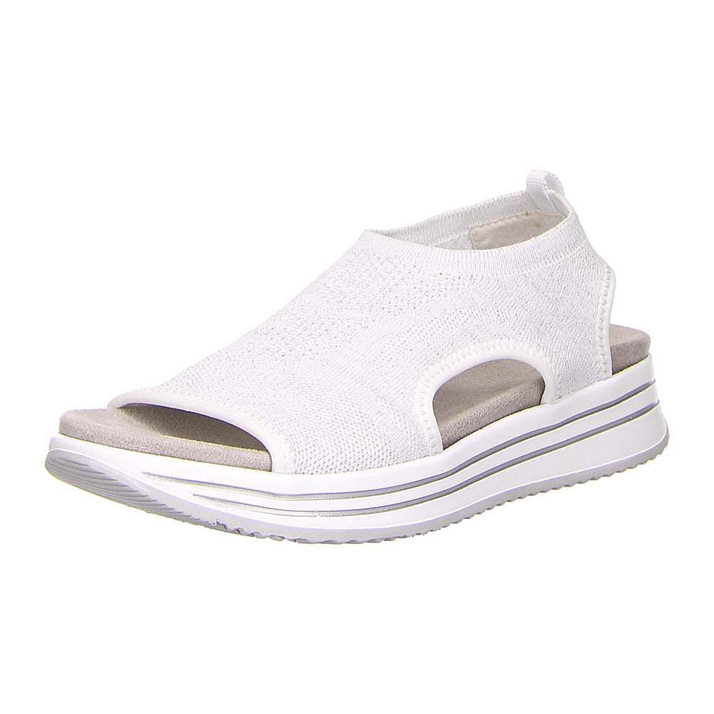 The REMONTE ATHLEISURE KNIT SANDAL WHITE - WOMENS by Remonte is a white, open-toe sporty chic wedge sandal with a stretch knit upper and a thick white sole featuring black stripes.