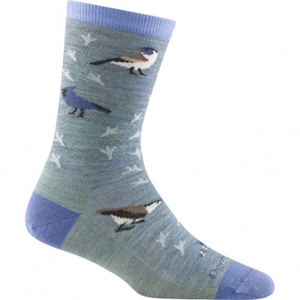 A single blue sock with a pattern of various birds, including blue jays, on a light blue background with a darker blue heel and toe. Made from premium Merino wool, these Darn Tough Women's Twitterpated Crew Lightweight socks come with a lifetime guarantee. The Darn Tough Twitterpated Crew Socks Seafoam offer the same high-quality construction and comfort you expect from Darn Tough.
