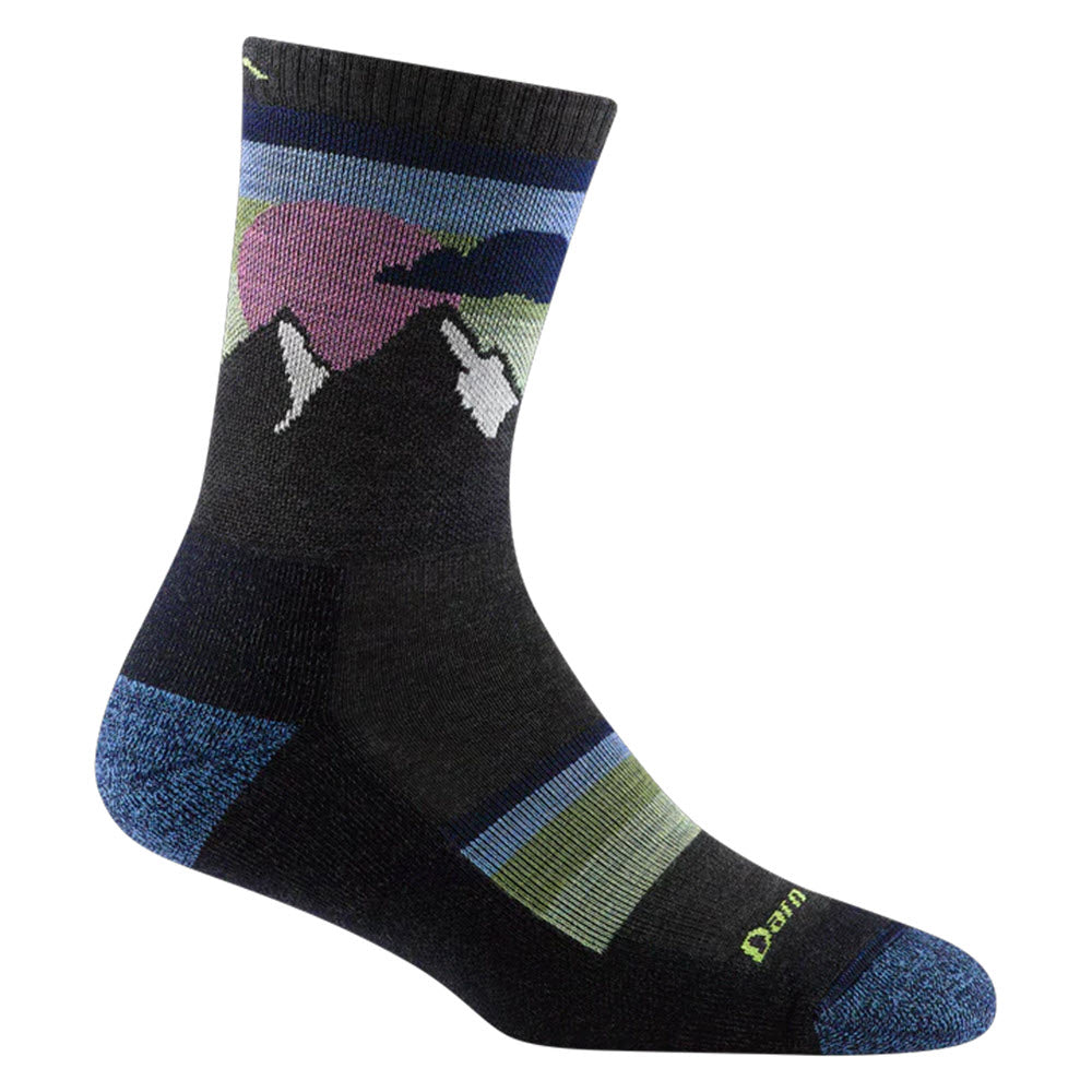 A single DARN TOUGH SUNSET RIDGE CREW SOCKS CHARCOAL- WOMENS featuring a colorful mountain and sunrise design, perfect for summer hikes. With shades of blue, green, pink, and purple, this lightweight hiking sock from Darn Tough has reinforced heel and toe areas in a lighter blue for added durability.