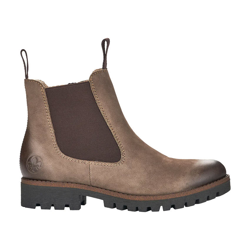 The Rieker RIEKER LUG SOLE CHELSEA WITH ZIP MUD - WOMENS features a brown Chelsea design with stretchy elastic side panels, pull tabs, and a thick black rubber sole with rugged traction.