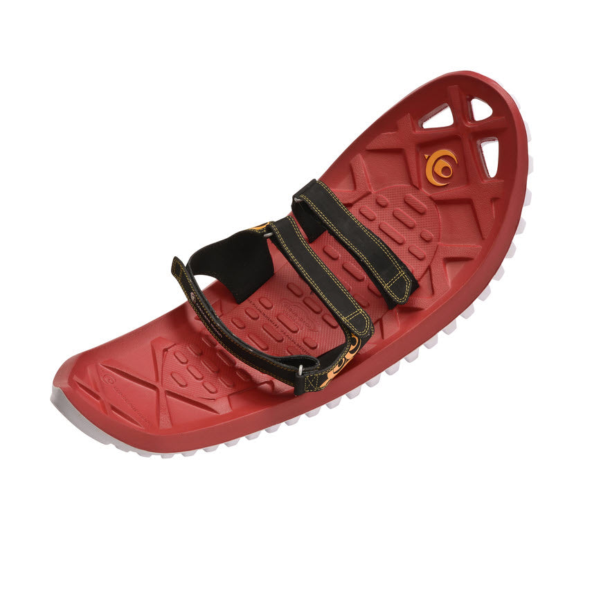 Red Crescent Moon CRESCENT MOON FOAM SNOWSHOES EVA RED - MENS with black adjustable straps, white grip studs on the bottom, and cushioning insulation for a comfortable journey.