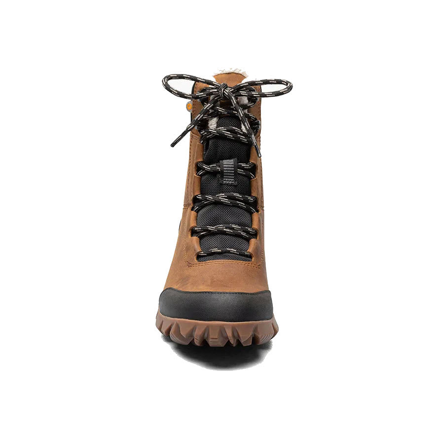 A front view of the Bogs Arcata Leather Caramel high-top hiking boot for women, showcasing its brown leather exterior, black laces, ultra-plush lining, and durable textured sole.